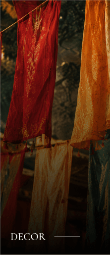 Decor: colourful patterned fabrics hanging in rows